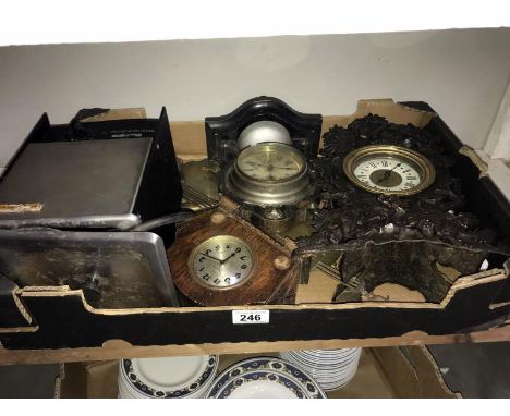 A selection of clock cases, some with movement, need attention