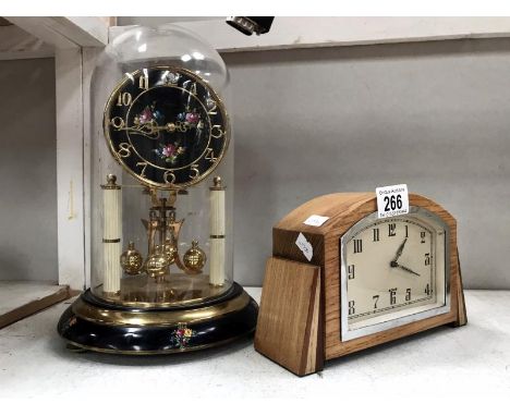 An Art Deco 8 day clock and anniversary clock under dome