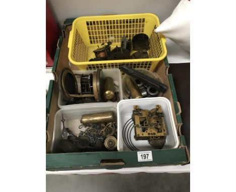 A box of good clock items including weights, springs and movements