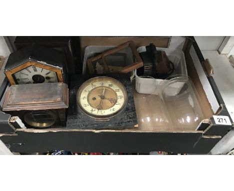 A selection of clock parts including cases, glass domes etc.
