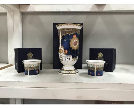 A Royal Worcester vase and 2 candle holders (all boxed)
