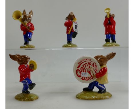 A collection of Royal Doulton Bunnykins figures to include Drummer DB26, Symbols DB25, Sousaphone DB23, Drum Major DB27 and T