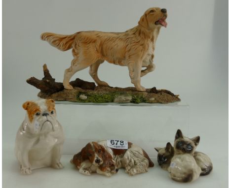 A collection of Royal Doulton animals figures to include Seated Bulldog, Siamese Kittens, Spaniel with pup and Golden Retriev