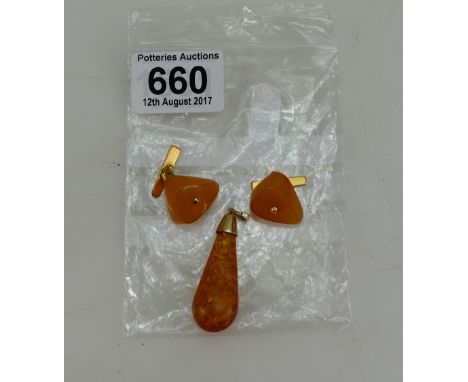 A vintage pair Baltic butterscotch amber cufflinks with 18ct gold mounts and a pendant with unmarked gold mount (total weight