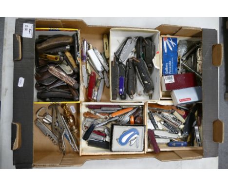 A large collection of pocket pen knives including pairing knives, early military pocket knives, together with swiss army type