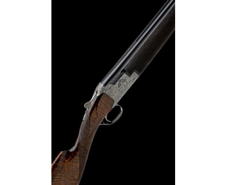 FABRIQUE NATIONALE A 12-BORE 'D4G' SINGLE-TRIGGER OVER AND UNDER EJECTOR, serial no. 49487 S75, for 1975, 27 5/8in. (70cm) ni