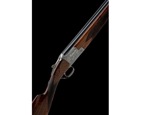 FABRIQUE NATIONALE A 12-BORE 'C2G' SINGLE-TRIGGER OVER AND UNDER EJECTOR, serial no. 54760 S75, for 1975, 27 5/8in. (70cm) ni