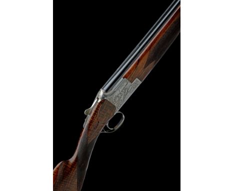 FABRIQUE NATIONALE A 12-BORE 'C2G' SINGLE-TRIGGER OVER AND UNDER EJECTOR, serial no. 52692 S75, for 1975, 27 5/8in. (70cm) ni