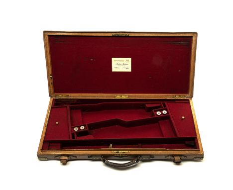 A BRASS-CORNERED OAK AND LEATHER DOUBLE GUNCASE WITH HUBERT ANTOINE TRADE LABEL, fitted for 28in. barrels, red baize-lined in