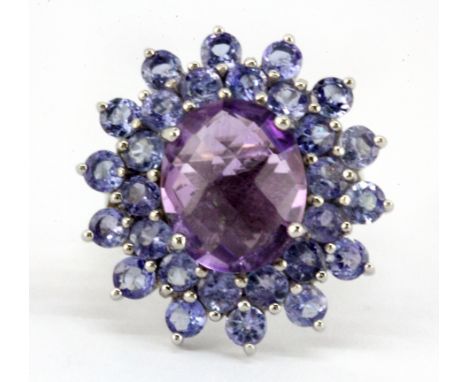 A 925 silver large cluster ring set with a checker board cut amethyst and tanzanites, 2 x 2.5cm, (M).