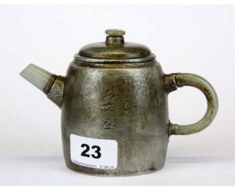 A Chinese pewter covered terracotta teapot with jade spout and handle, (with a repair where the handle is attached to the bod