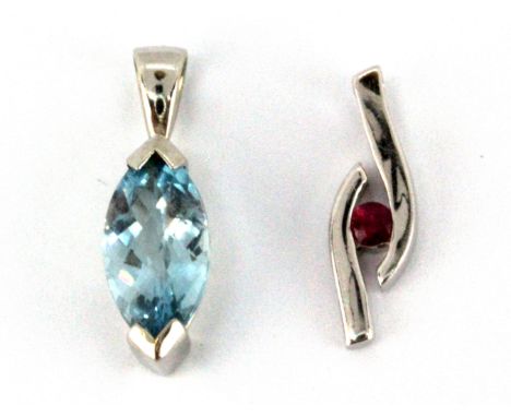 A 9ct yellow gold pendant set with a marquise shaped checker board cut Swiss blue topaz and a further 9ct white gold pendant 