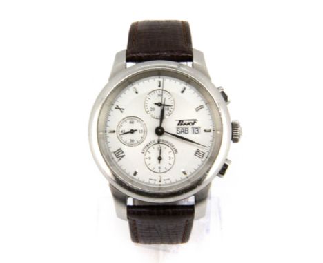 A boxed gentleman's Tissot wrist watch on a leather strap, with Tissot gift bag and paperwork.