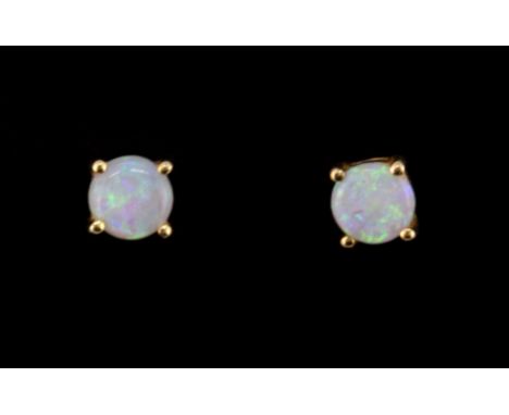 A pair of 9ct yellow gold cabochon cut opal set stud earrings.