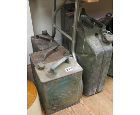 Two military Jerry cans, and three pre-war petrol cans, Shell, Esso and BP, as viewed 