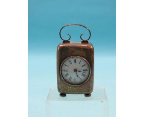 A miniature silver-cased carriage clock, 1901, enamelled circular dial and French movement, on four ball toes, 5in.