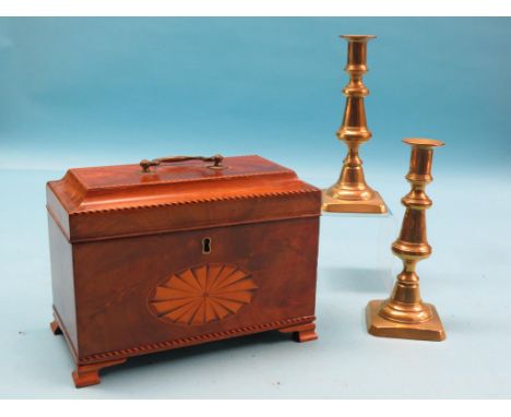 A George III mahogany tea caddy, partitioned interior with concealed drawer beneath, frontage inlaid with bats-wing oval, 9.5