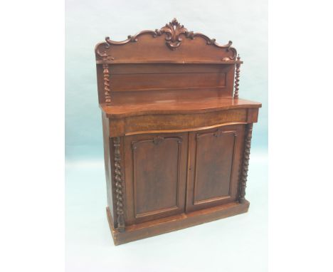 A Victorian mahogany chiffonier, over-shelf on barley-twist supports, serpentine-fronted cupboard base with single drawer, 3f