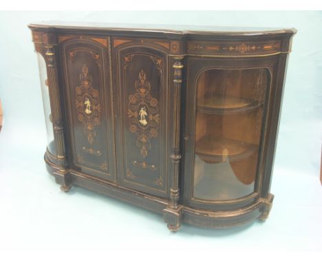 A Victorian ebonised credenza, pair of central cupboard doors elaborately inlaid with leafage and urns, portrait ovals in eng