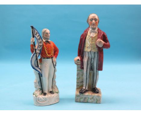 Two Victorian Staffordshire pottery portrait figures, Garibaldi carrying flag, 'Liberte', male standing with books, 10in. and