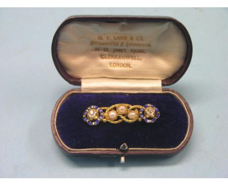 A 14ct. gold bar brooch, set two diamonds within blue enamel and three pearls, all within a rope-twist design, in fitted leat