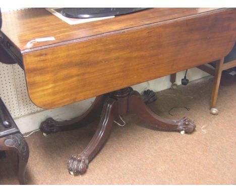 An early 19th century mahogany drop-leaf breakfast table, with single drawer, pedestal stem and four outswept legs with good 