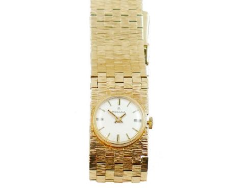 Rodania - a 9ct gold lady's manual wind wristwatch, London 1971, the white enamel dial with baton makings, textured brick pat