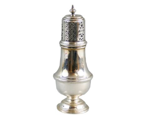 A silver caster, Birmingham 1931, of baluster form with turned finial and pierced removable top 17cm high 4oz