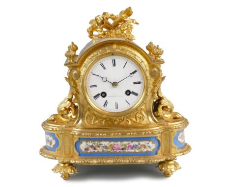 Howell & Cie - Paris - a late 19th century ormulu and porcelain mantle clock, the white enamel dial with Roman numerals and s