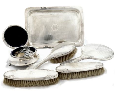 A silver six piece dressing table set, Birmingham/Chester 1912, with engine turned decoration, comprising; a rectangular tray