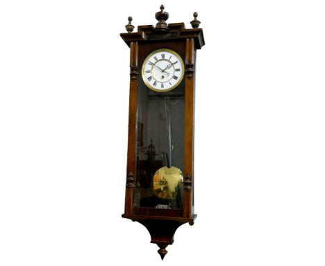 A Vienna style wall clock, the white enamel two part dial with Roman numerals, the single train movement unsigned and unnumbe