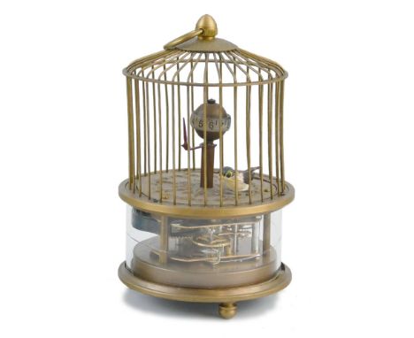 A novelty bird cage automaton clock, the bird on the cage floor with a globe clock, visible movement beneath, 15 cm, height 