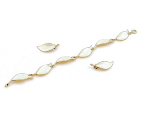 David Anderson - a Norwegian silver gilt and enamel bracelet and pair of ear clips, in the form of leaves with white enamel (
