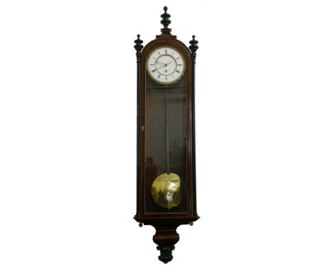 A Vienna style wall clock, the white enamel two part dial with Roman numerals and an ornate outer brass chapter ring, the sin