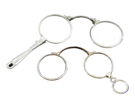 A pair of Victorian l'orgnettes, with yellow metal frames and figure-of-eight handle 6.5cm closed and another pair of white m