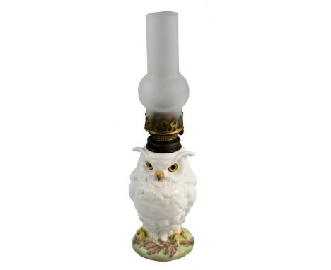 A William Whiteley table oil lamp, the French porcelain base modelled as a white glazed owl with inset glass eyes supporting 