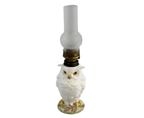 A William Whiteley table oil lamp, the French porcelain base modelled as a white glazed owl with inset glass eyes supporting 