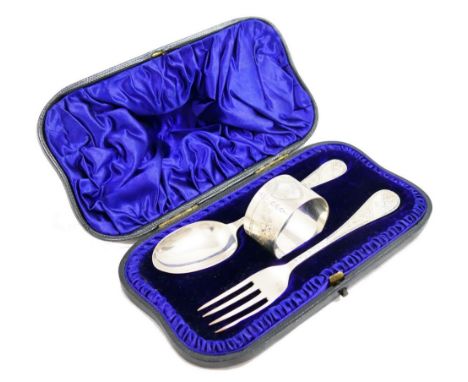 A Victorian silver three piece christening set, comprising napkin ring, Sheffield 1894 and spoon and fork, London 1892, with 