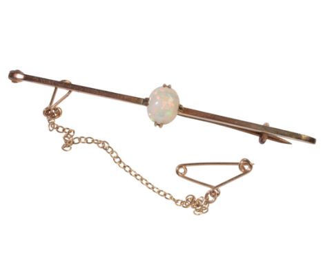 AN ANTIQUE OPAL BAR BROOCHin 9ct yellow gold, set with an opal, secured with a pin clasp and safety chain, stamped '9CT', c.6