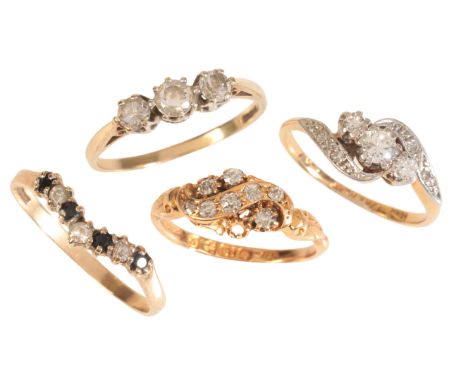 FOUR GEM-SET RINGSincluding a three stone diamond ring in 18ct gold and platinum, set with three graduated round brilliant-cu