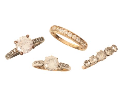 THREE PASTE RINGSincluding an antique five stone paste ring in silver on 9ct gold; a paste solitaire ring; and a paste half e