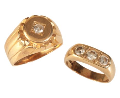 TWO DIAMOND RINGSincluding a diamond three stone ring in 18ct gold, set with three round brilliant-cut diamonds totalling c.0