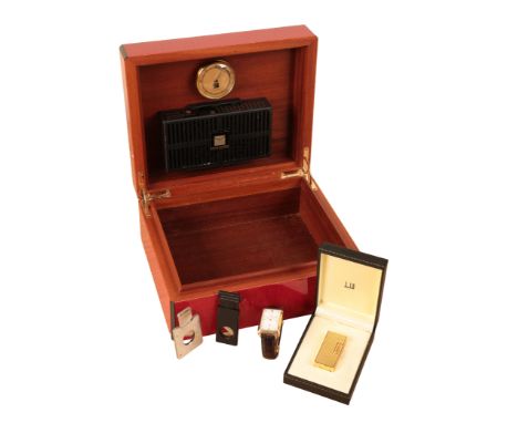 A RED SYCAMORE HUMIDORwith ebonised banding, with internal Cigar Master and Daniel Moevus moisture gauges, reputedly purchase