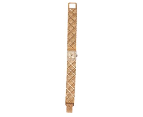 ROLEX: A LADY'S 14CT WHITE GOLD & DIAMOND-SET BRACELET WATCHwith manual wind movement, the silver dial with silver baton nume