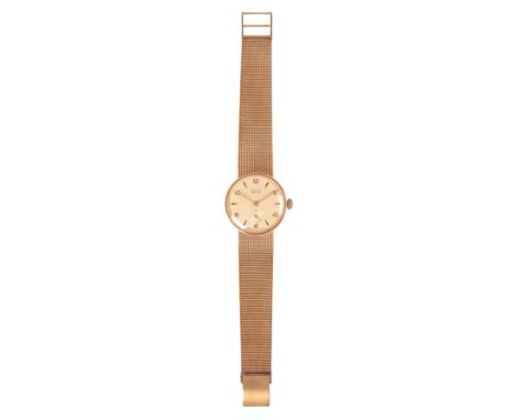 VERTEX REVUE: A GENTLEMAN'S 9CT GOLD BRACELET WATCHwith manual wind movement, the silver dial with subsidiary seconds dial, g