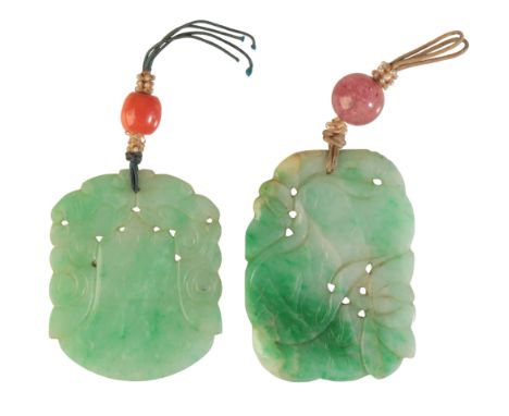 TWO CARVED JADE PENDANTSone carved in a stylised design, suspended below a drilled coral bead, c.4.0x4.9x0.4cm; the other car