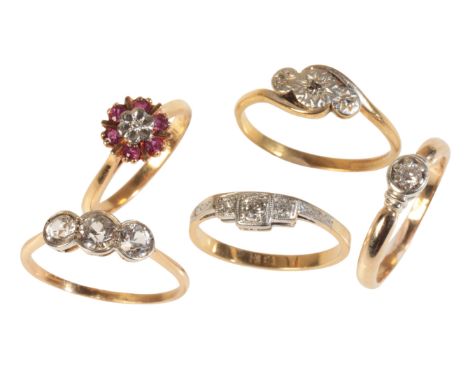 FIVE DIAMOND RINGSincluding a diamond three stone ring in 18ct gold; a diamond three stone ring in 18ct gold and platinum, se