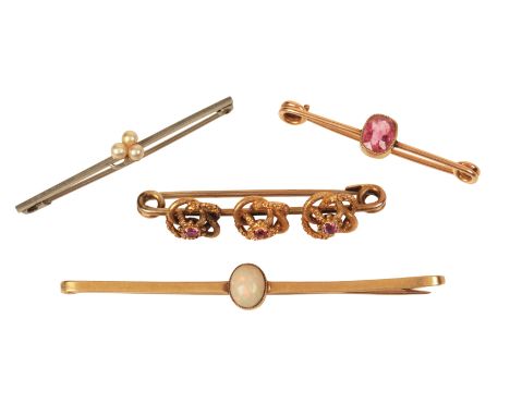 FOUR BAR BROOCHESincluding an opal bar brooch in 15ct gold, c.6.8cm; together with a ruby bar brooch, set with three cushion-