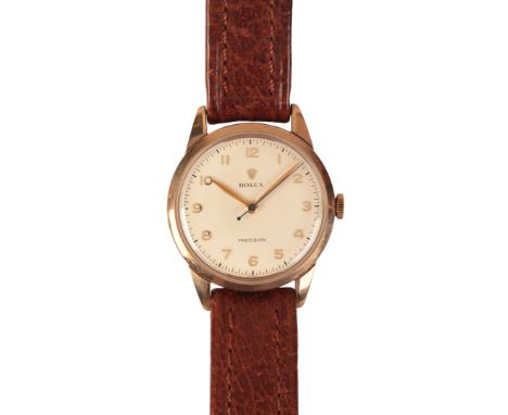 ROLEX PRECISION: A GENTLEMAN'S GOLD-PLATED WRISTWATCHwith manual wind movement, the white dial with gold Arabic numerals and 