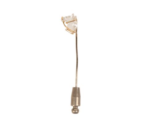 A DIAMOND HORSE STICK PINin 18ct and 14ct yellow and white gold, set with a horse cut diamond of c.0.75 carats, held in a bri
